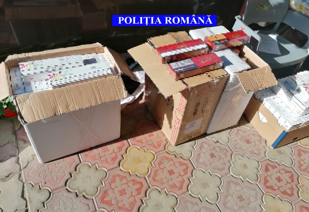 Percheziţii într-un dosar de contrabandă cu ţigări, într-o comună din Olt. Marfa netimbrată, adusă din Craiova